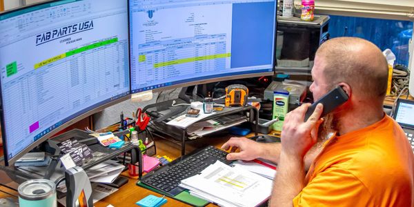 FAB Parts USA engineer designing a custom fabricated part on a CAD workstation